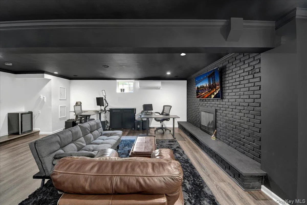 Completely updated and finished basement area with fireplace and half bathroom Completely updated and finished basement area with fireplace and half bathroom