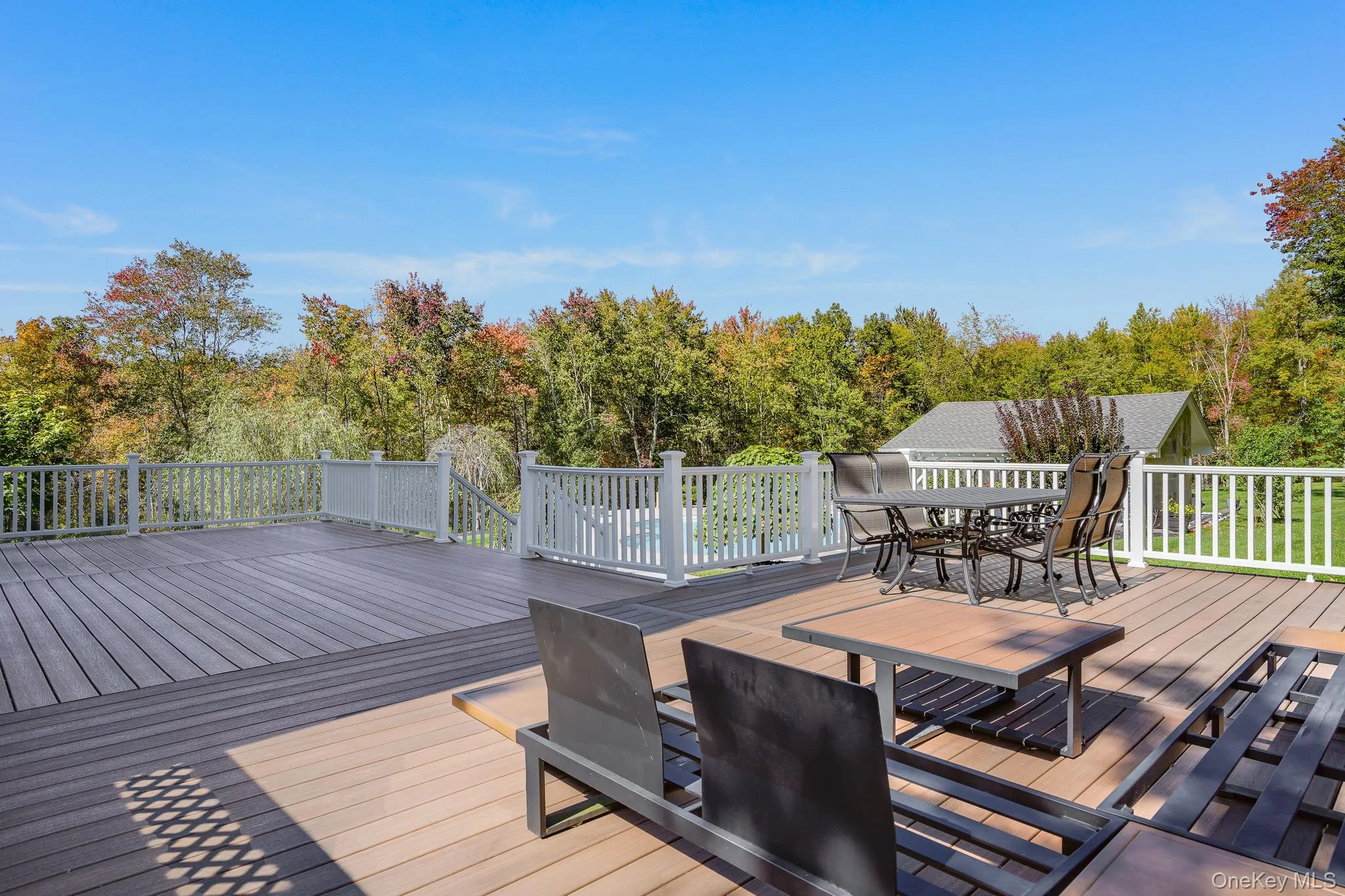 Expansive deck with sitting area. Expansive deck with sitting area.