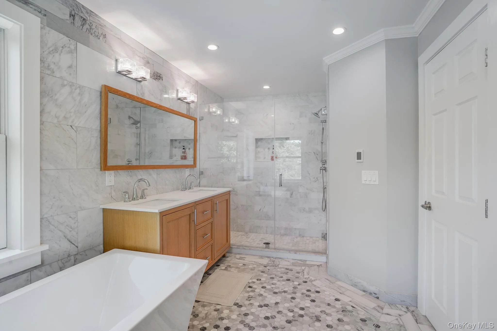 Master bathroom with a soaking tub, shower, custom double vanity and radiant heated floors. Master bathroom with a soaking tub, shower, custom double vanity and radiant heated floors.