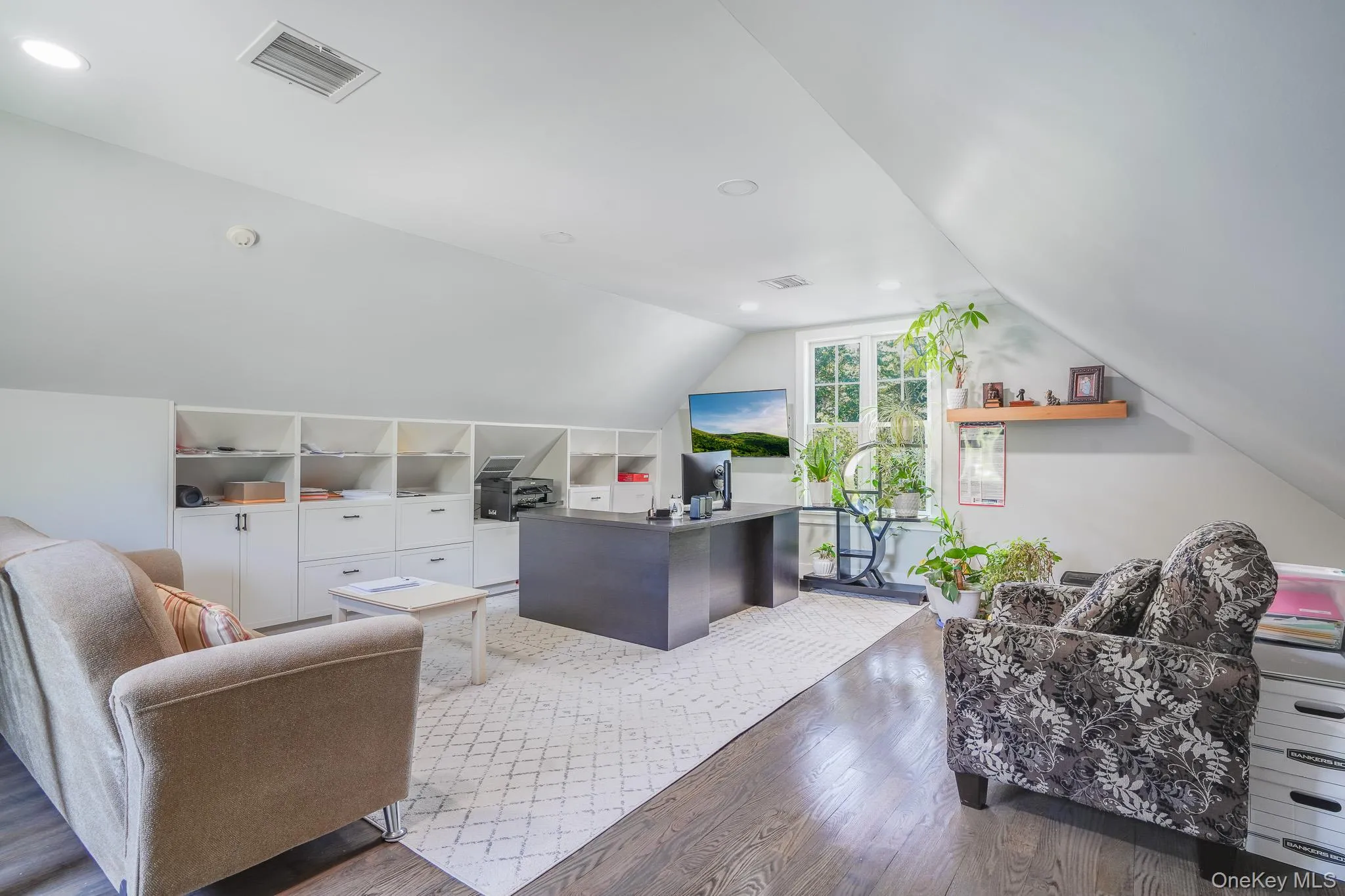 Office above the garage with built in shelves. Office above the garage with built in shelves.