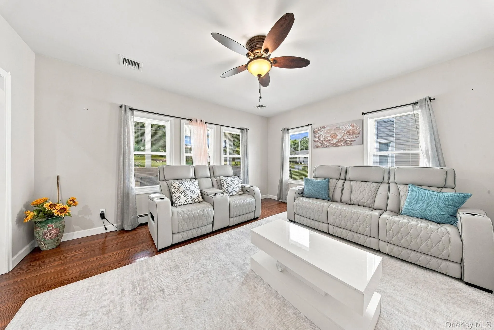 Hardwood flooring, painted walls, ceiling fan, multiple windows with natural light Hardwood flooring, painted walls, ceiling fan, multiple windows with natural light