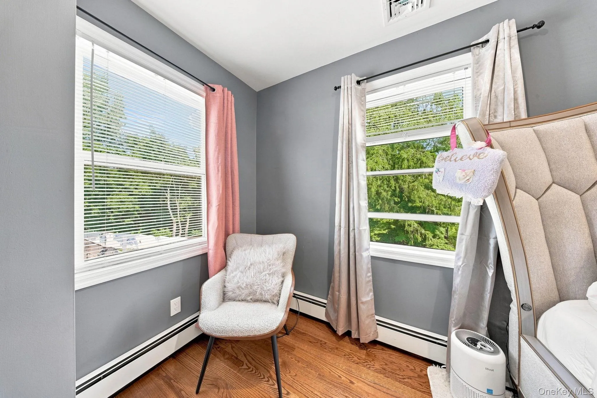 Hardwood flooring, painted walls, and window treatments with blinds Hardwood flooring, painted walls, and window treatments with blinds