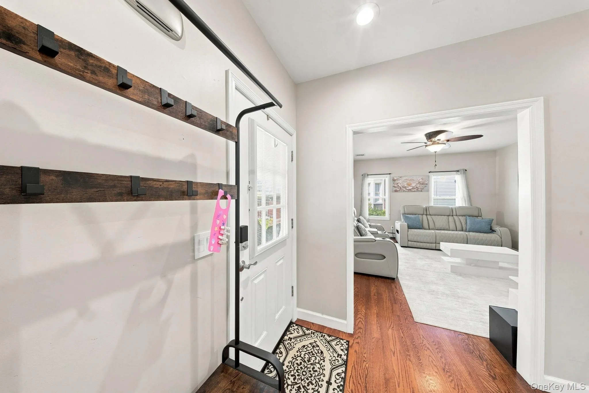 Entrance featuring hardwood floors Entrance featuring hardwood floors