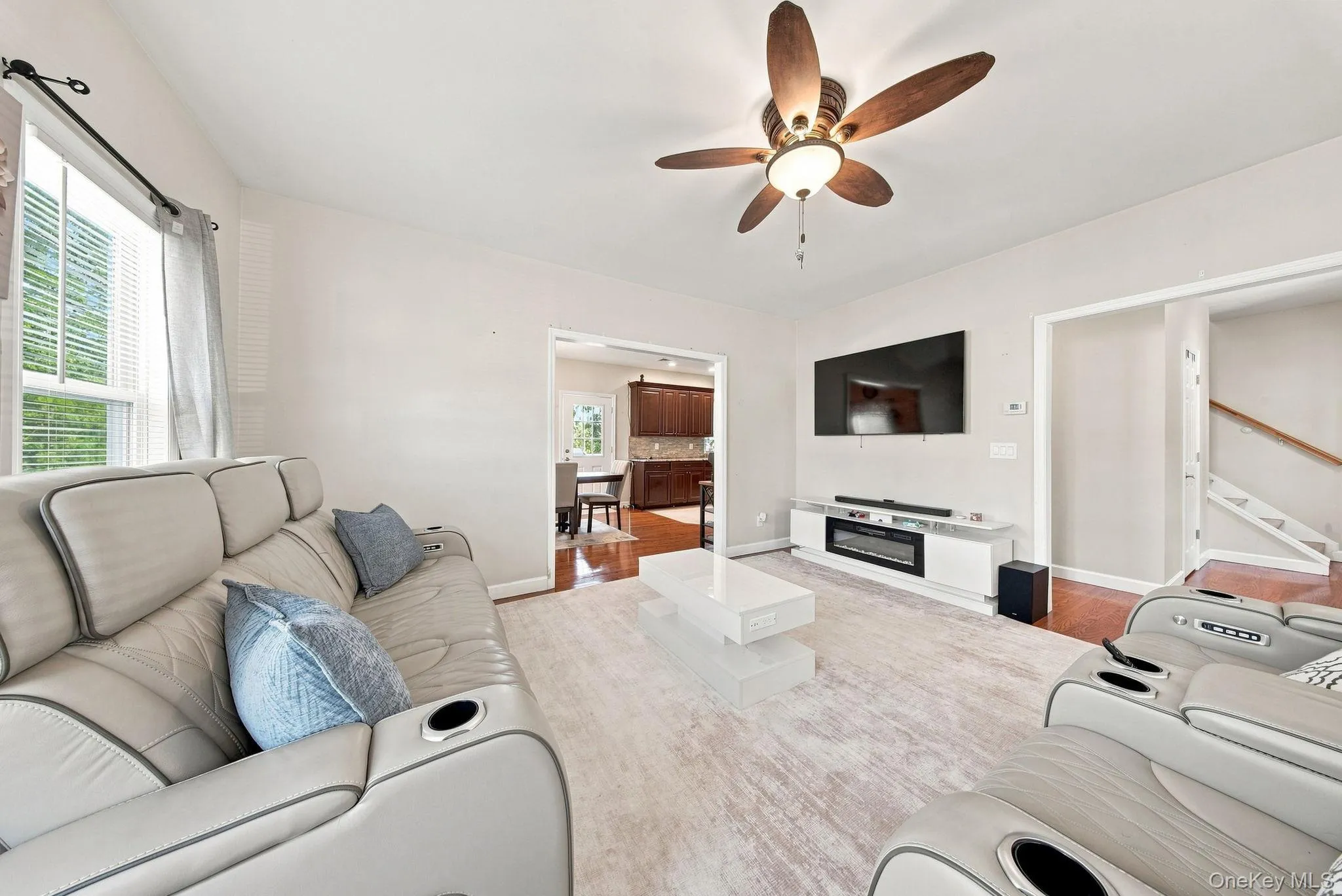 Recessed electric fireplace with a white media console Recessed electric fireplace with a white media console