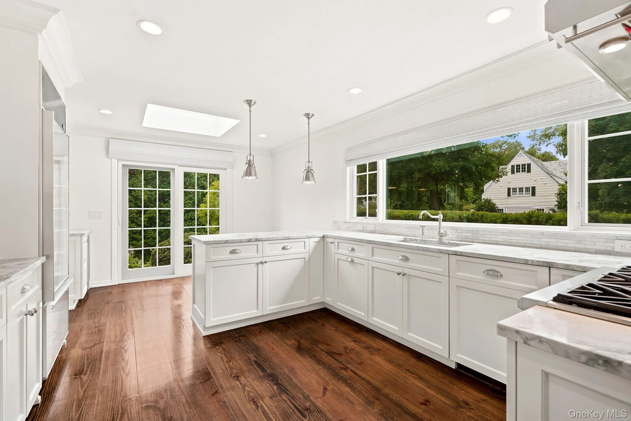 Kitchen with view of Breakfast Area and sliding glass doors to patio Kitchen with view of Breakfast Area and sliding glass doors to patio