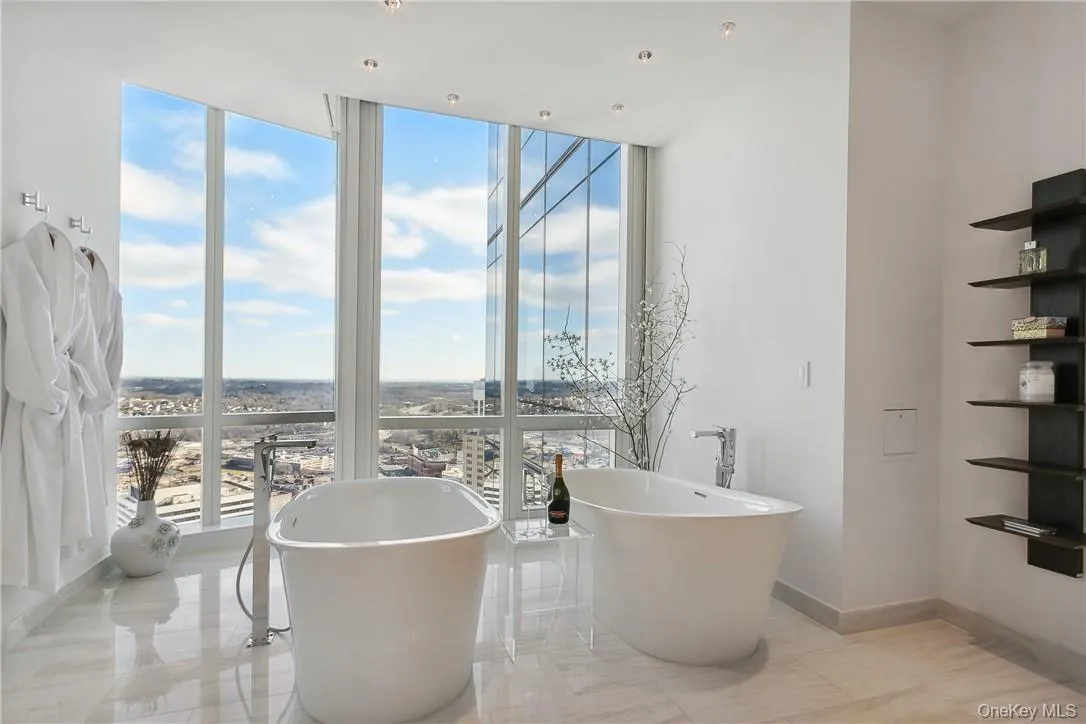 Primary Bathroom featuring 3 vanities, double shower and double tubs Primary Bathroom featuring 3 vanities, double shower and double tubs