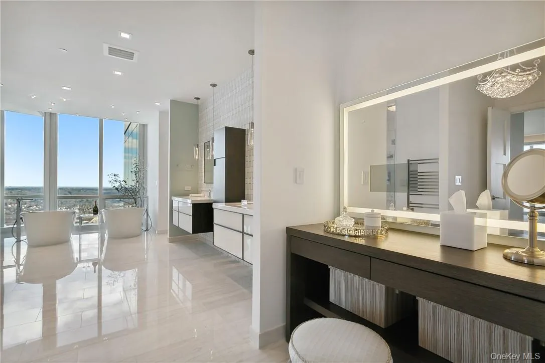 Primary Bathroom featuring 3 vanities, double shower and double tubs Primary Bathroom featuring 3 vanities, double shower and double tubs