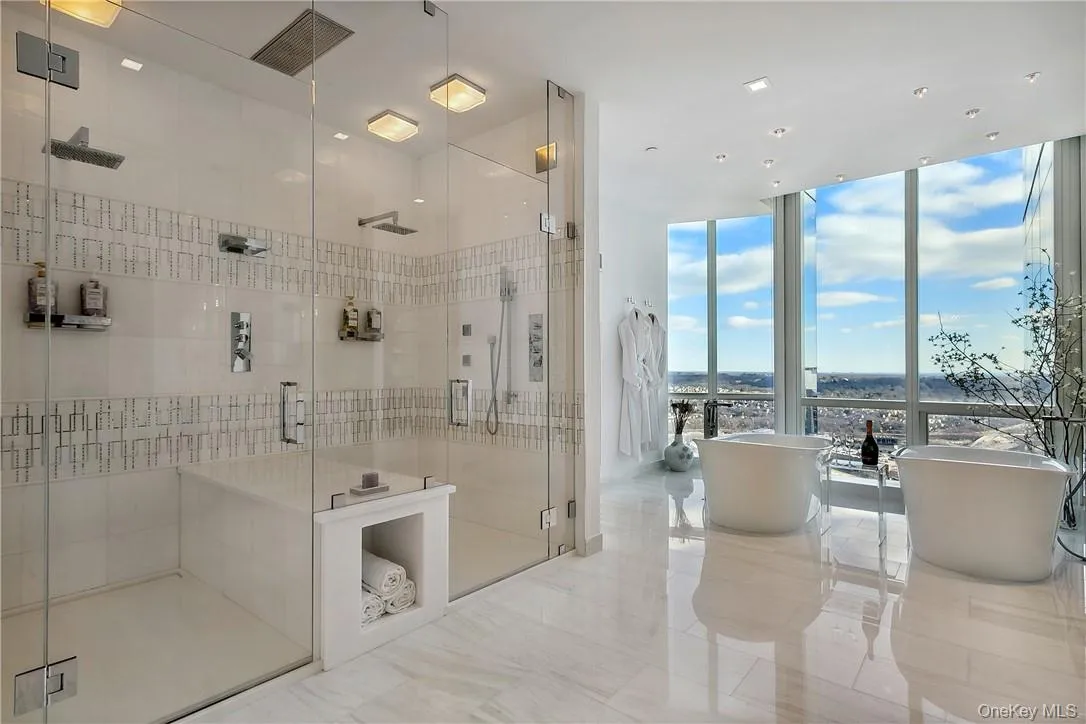 Primary Bathroom featuring 3 vanities, double shower and double tubs Primary Bathroom featuring 3 vanities, double shower and double tubs