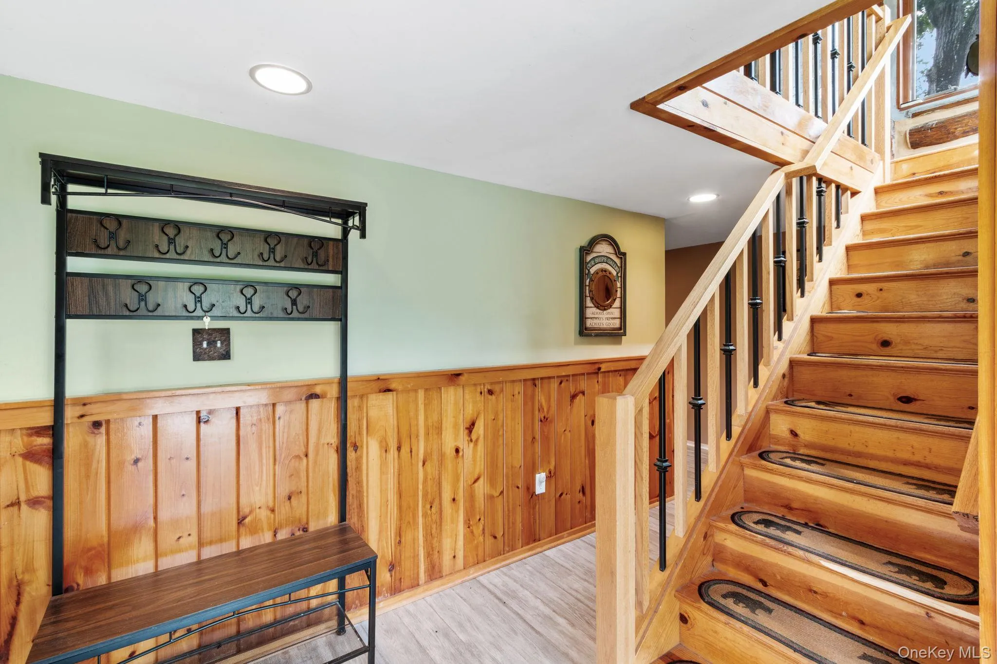 Spacious and welcoming foyer with plenty of room to sit down, take off your shoes, and drop your bags. Spacious and welcoming foyer with plenty of room to sit down, take off your shoes, and drop your bags.