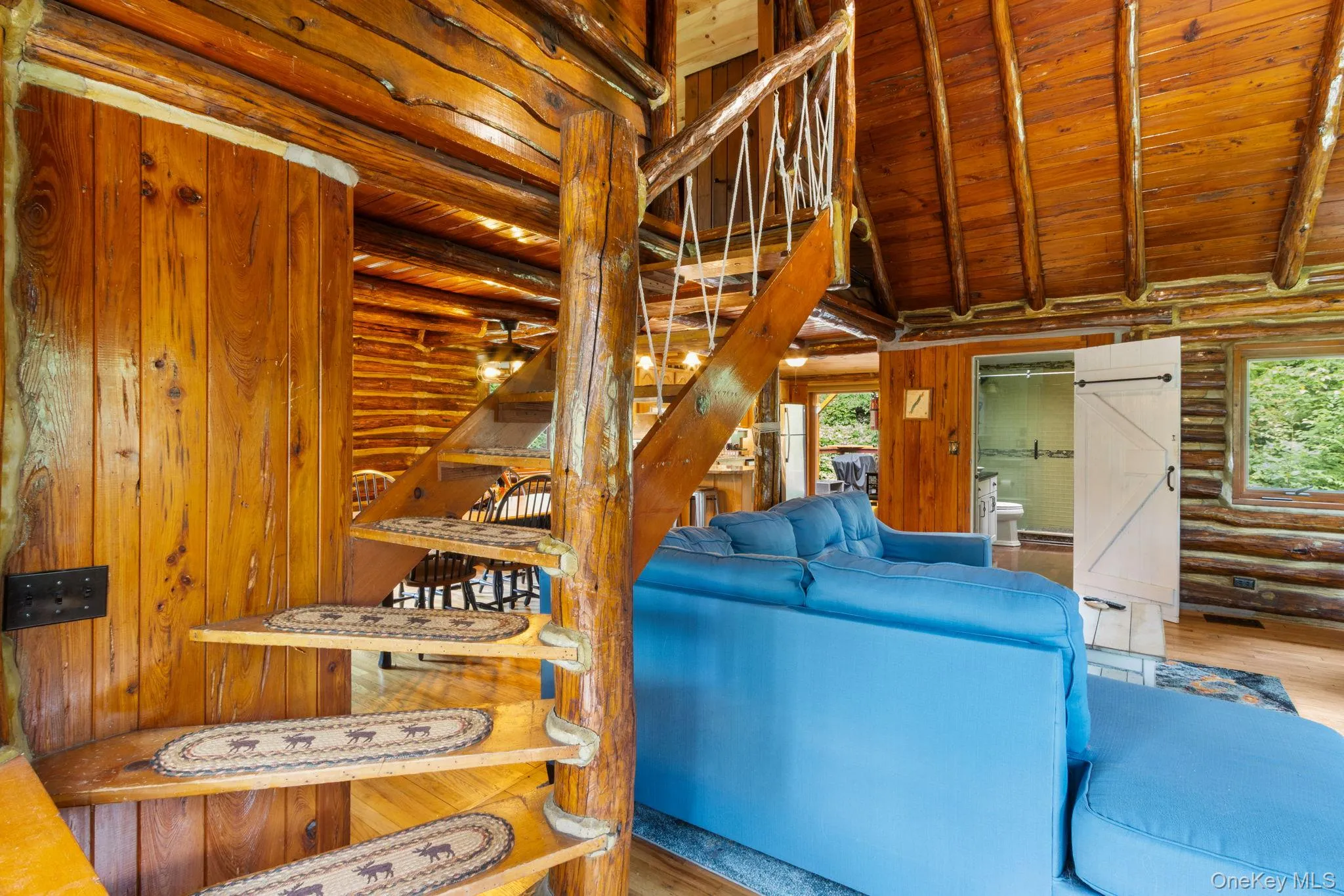 Stairs lead up to a cozy loft, perfect for a home office or quiet workspace. Stairs lead up to a cozy loft, perfect for a home office or quiet workspace.