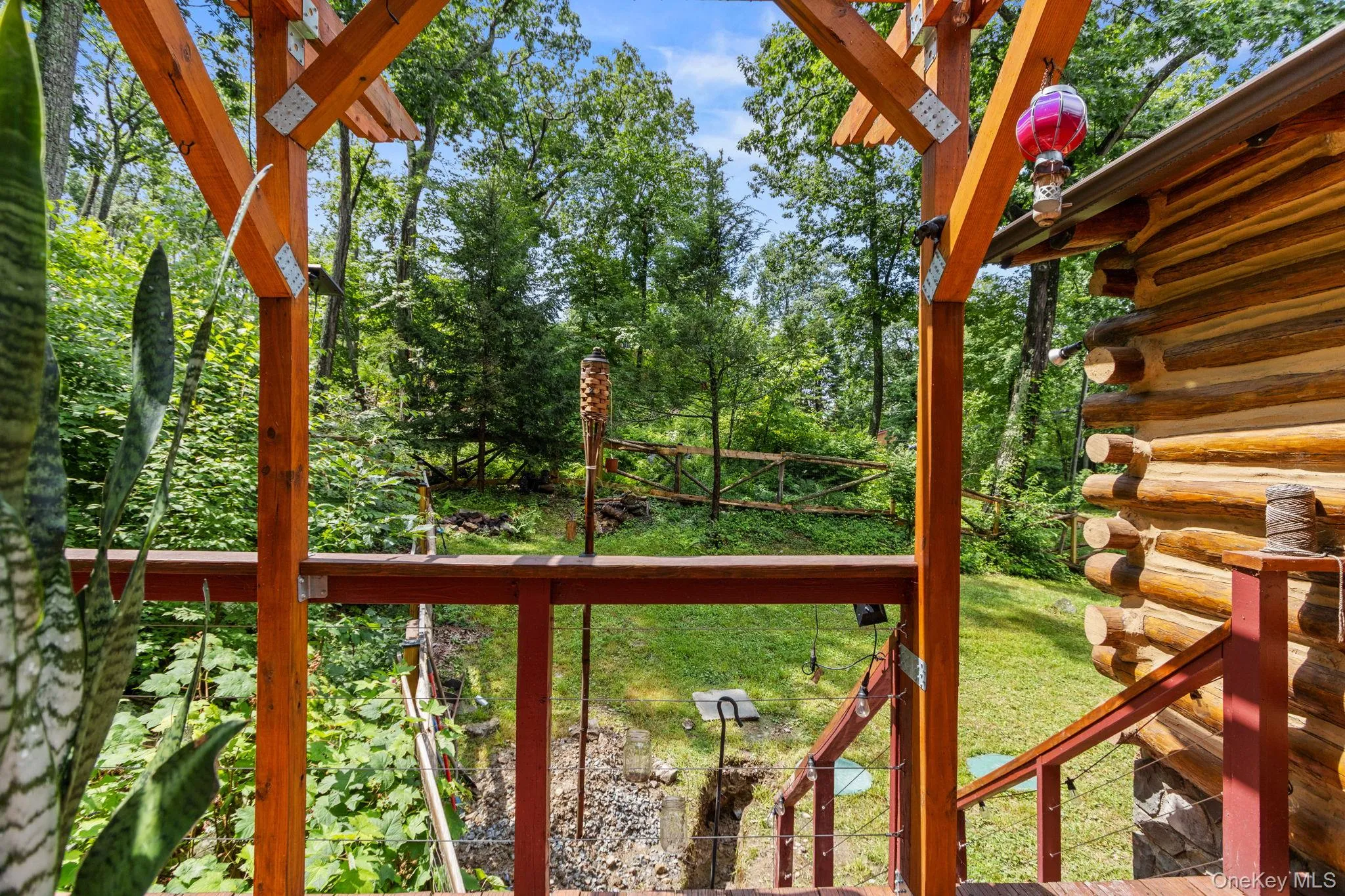 Serene deck surrounded by lush woods, perfect for barbecuing or spending time with friends and family. Serene deck surrounded by lush woods, perfect for barbecuing or spending time with friends and family.