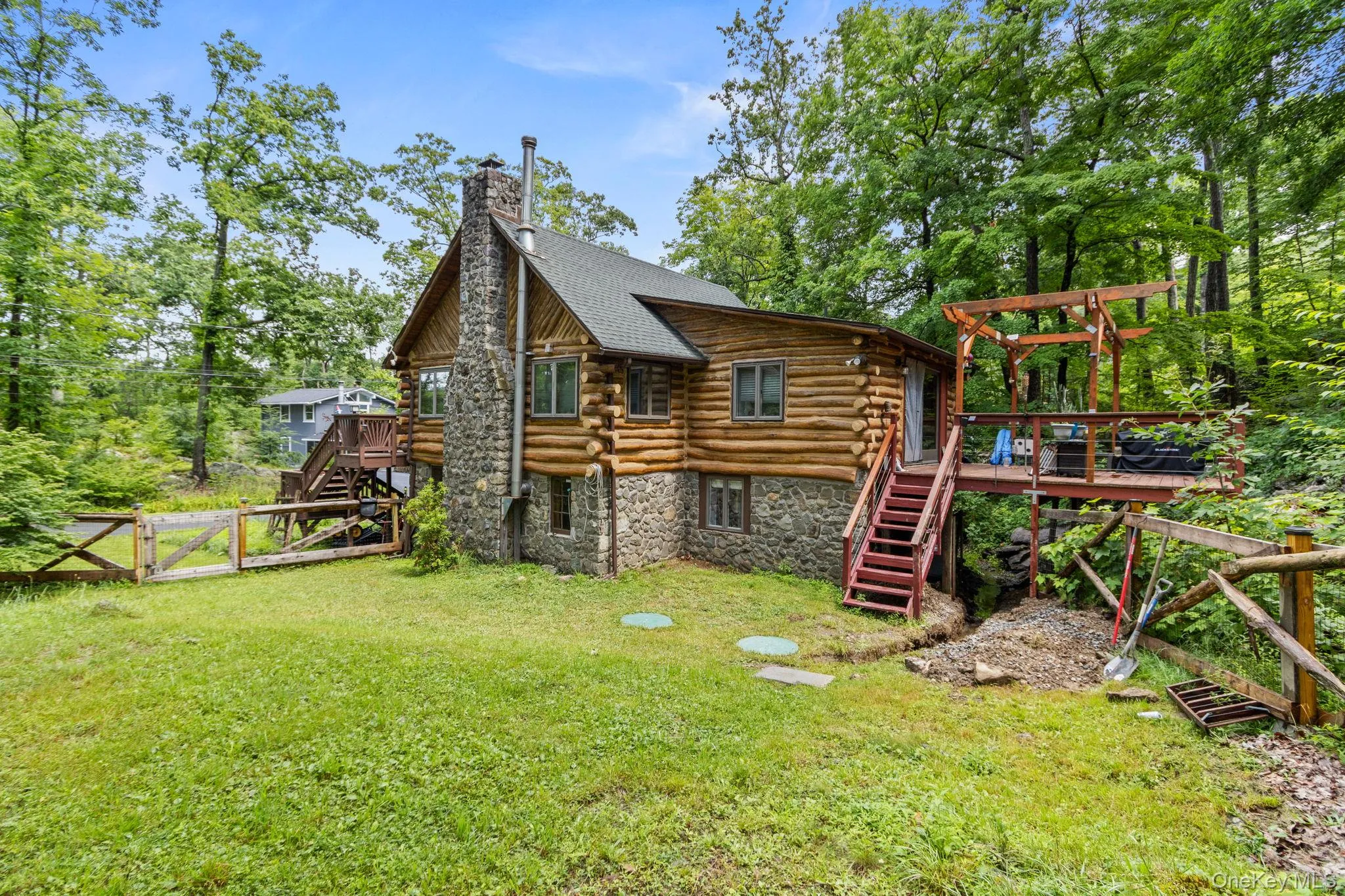 Private, fenced-in side yard with plenty of space for a fire pit and outdoor gatherings. Private, fenced-in side yard with plenty of space for a fire pit and outdoor gatherings.