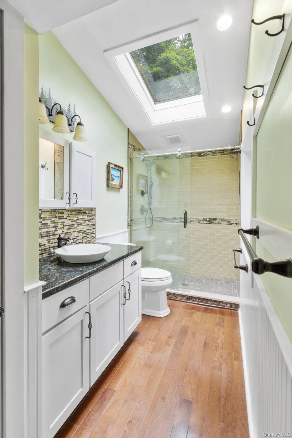 Sun-drenched second full bathroom filled with natural light. Sun-drenched second full bathroom filled with natural light.