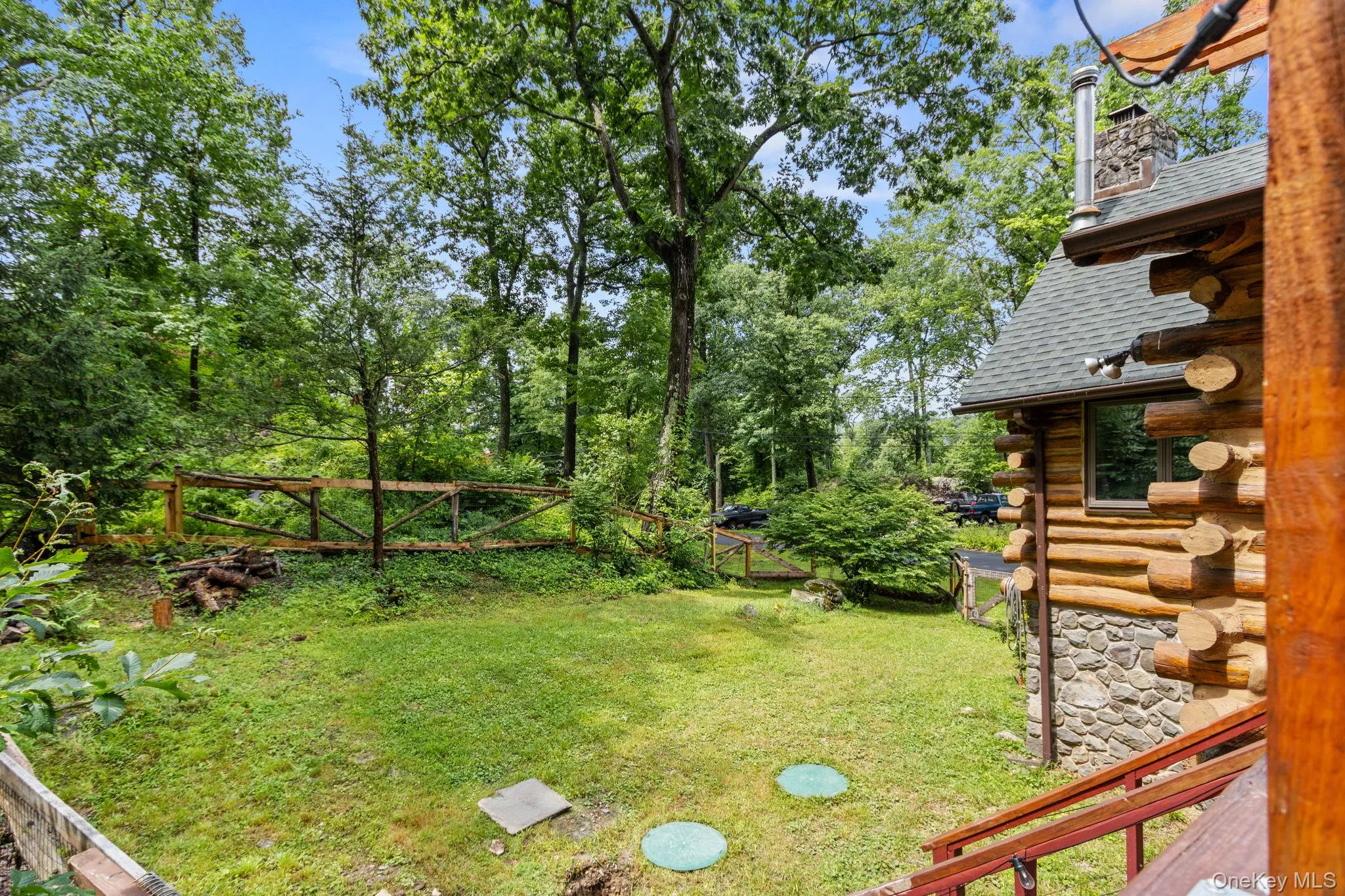 Private, fenced-in side yard with plenty of space for a fire pit and outdoor gatherings. Private, fenced-in side yard with plenty of space for a fire pit and outdoor gatherings.