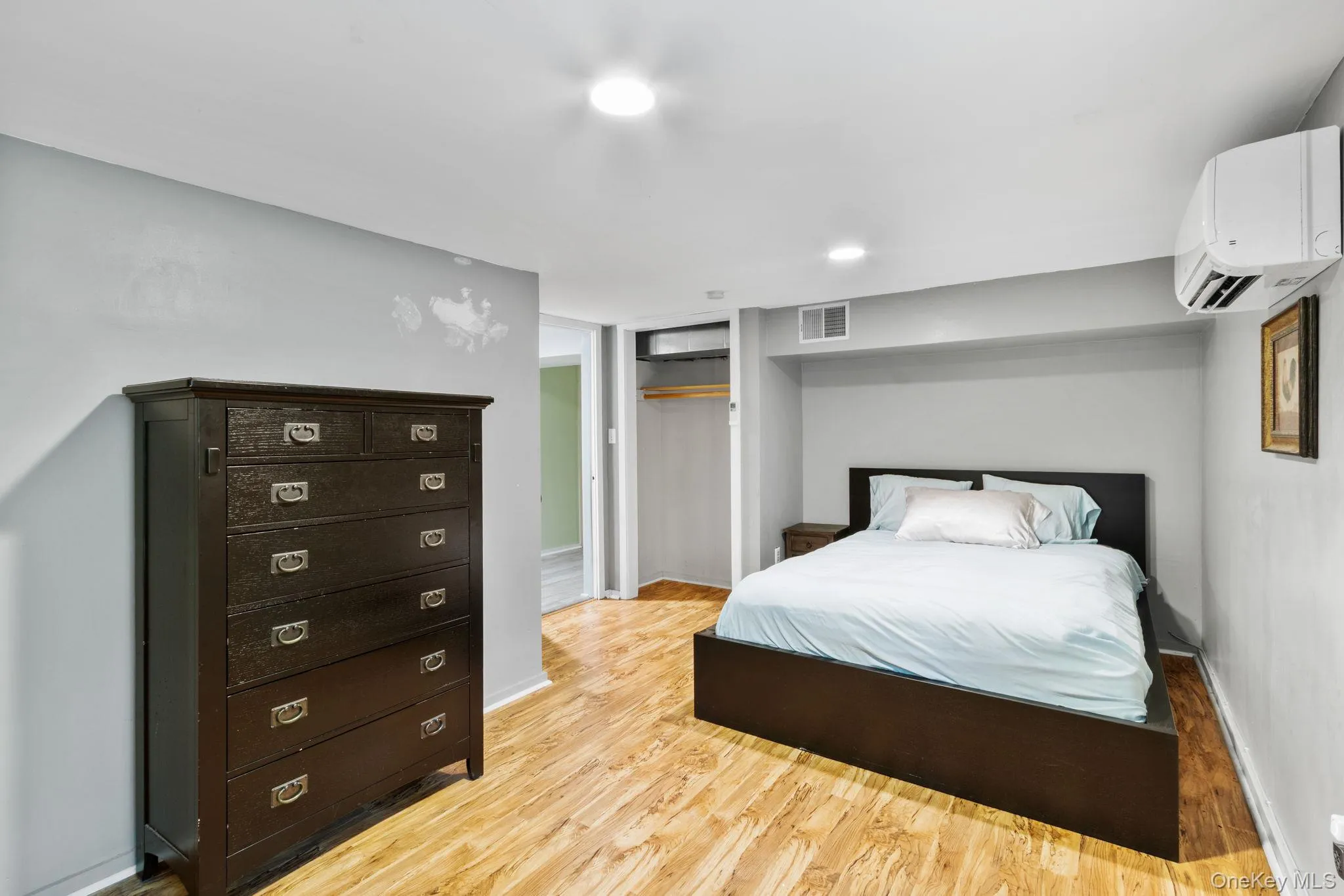 The second of two cozy bedrooms located on the main level, featuring peaceful forest views. The second of two cozy bedrooms located on the main level, featuring peaceful forest views.