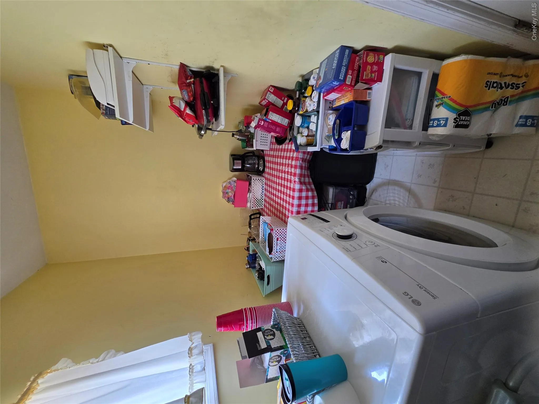 Dryer located in first floor pantry off kitchen Dryer located in first floor pantry off kitchen