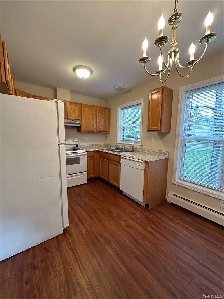 Newer counter tops and vinyl plank flooring in the kitchen. Newer counter tops and vinyl plank flooring in the kitchen.