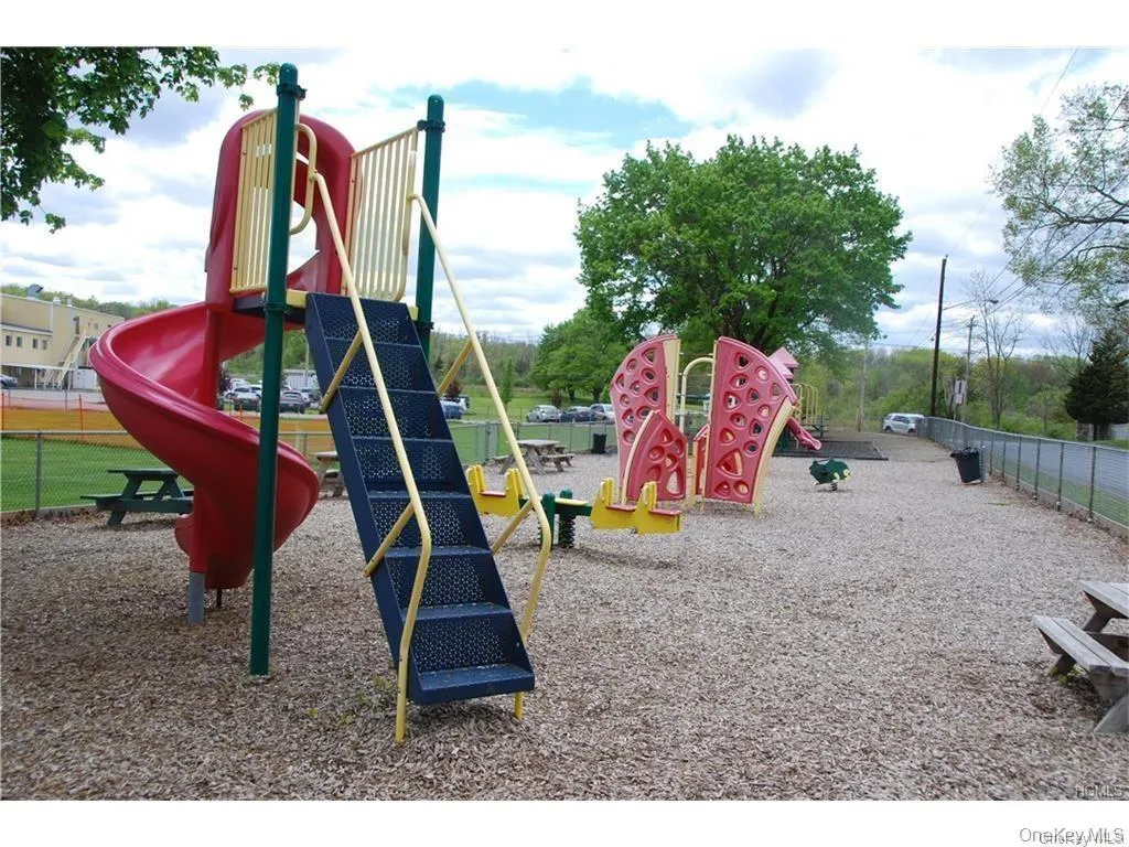 The large playground is just down the street. The large playground is just down the street.