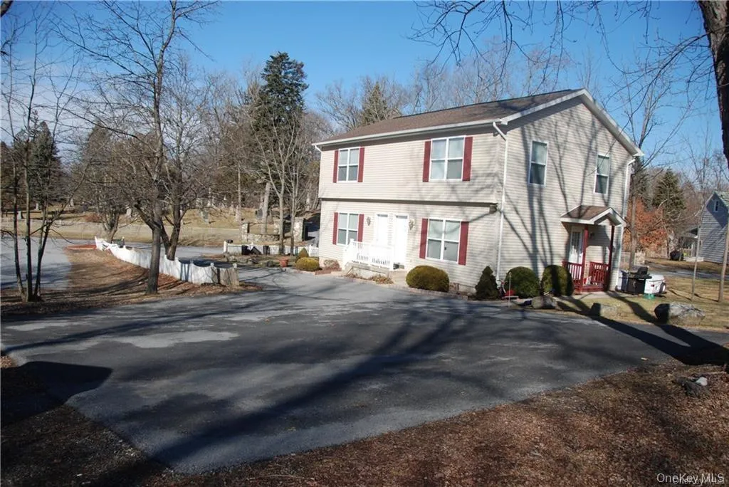 Large parking area for 4 cars total (2 spots per unit). Large parking area for 4 cars total (2 spots per unit).
