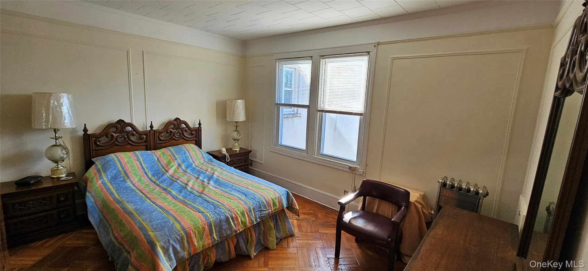 Bedroom featuring crown molding Bedroom featuring crown molding
