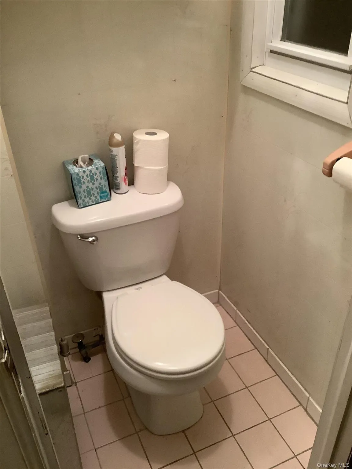Bathroom with light tile patterned floors Bathroom with light tile patterned floors