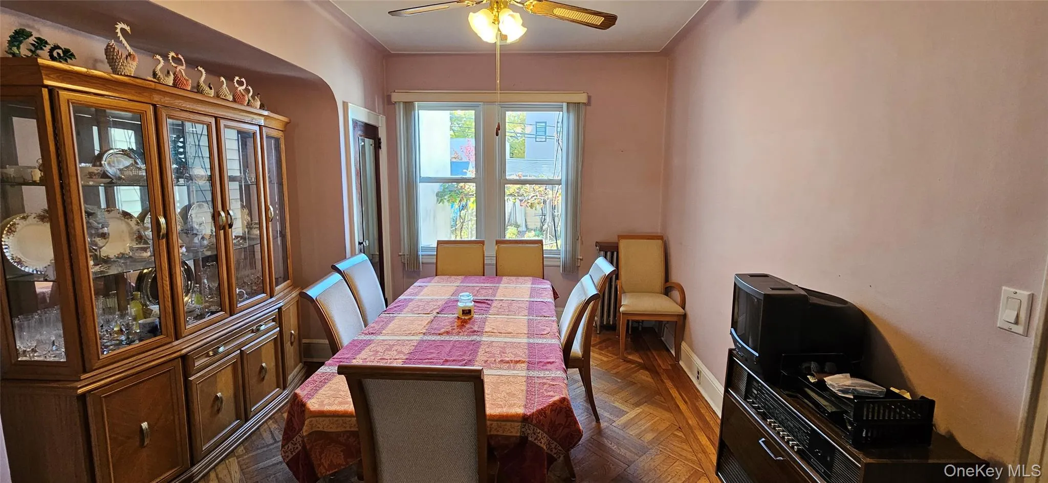 Dining room with a ceiling fan and baseboards Dining room with a ceiling fan and baseboards