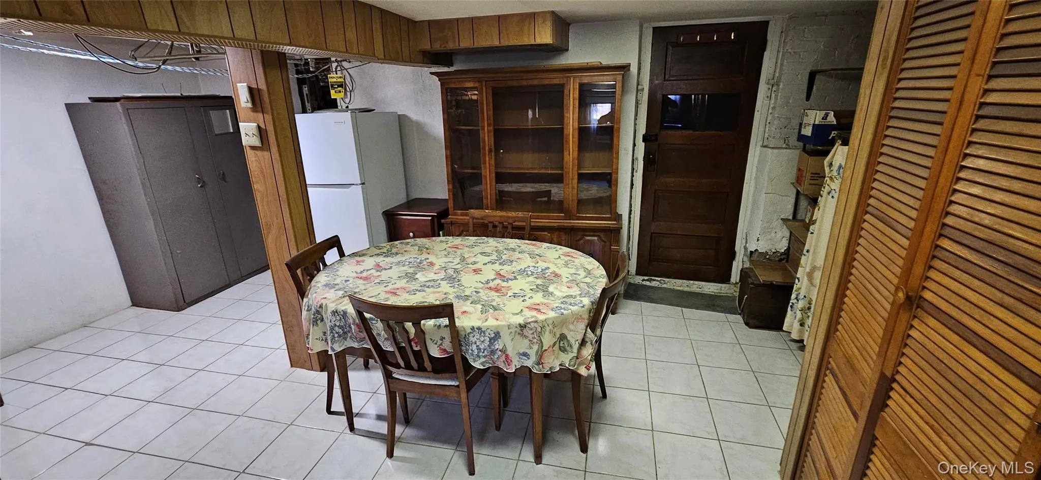 Dining room with light tile patterned floors Dining room with light tile patterned floors