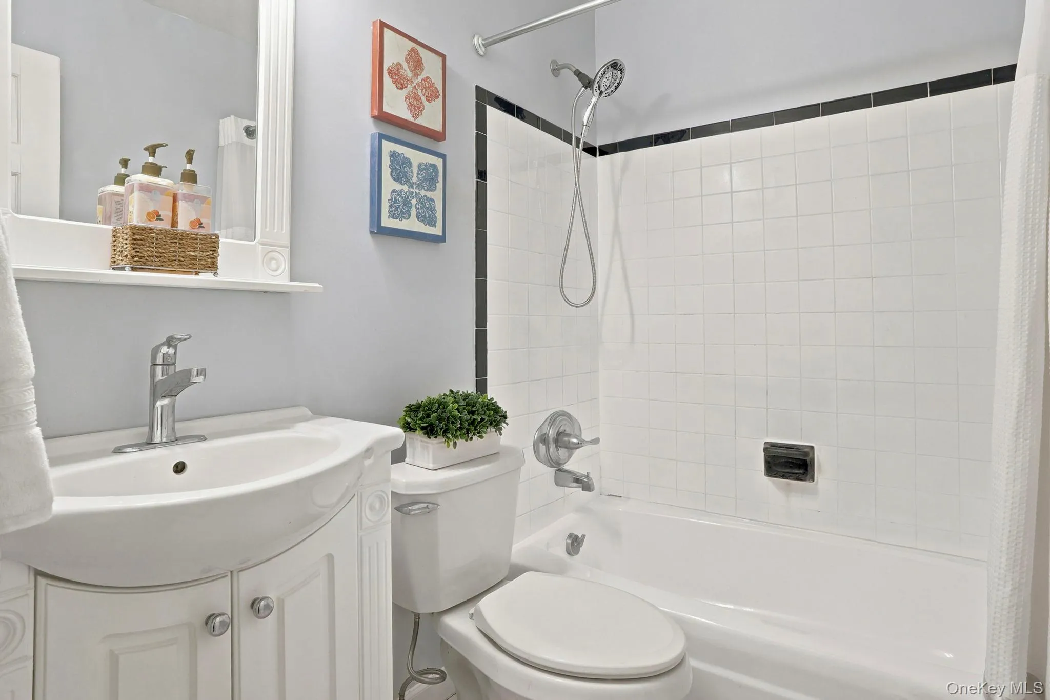The bright white full bathroom has a newly glazed bath tub. The bright white full bathroom has a newly glazed bath tub.