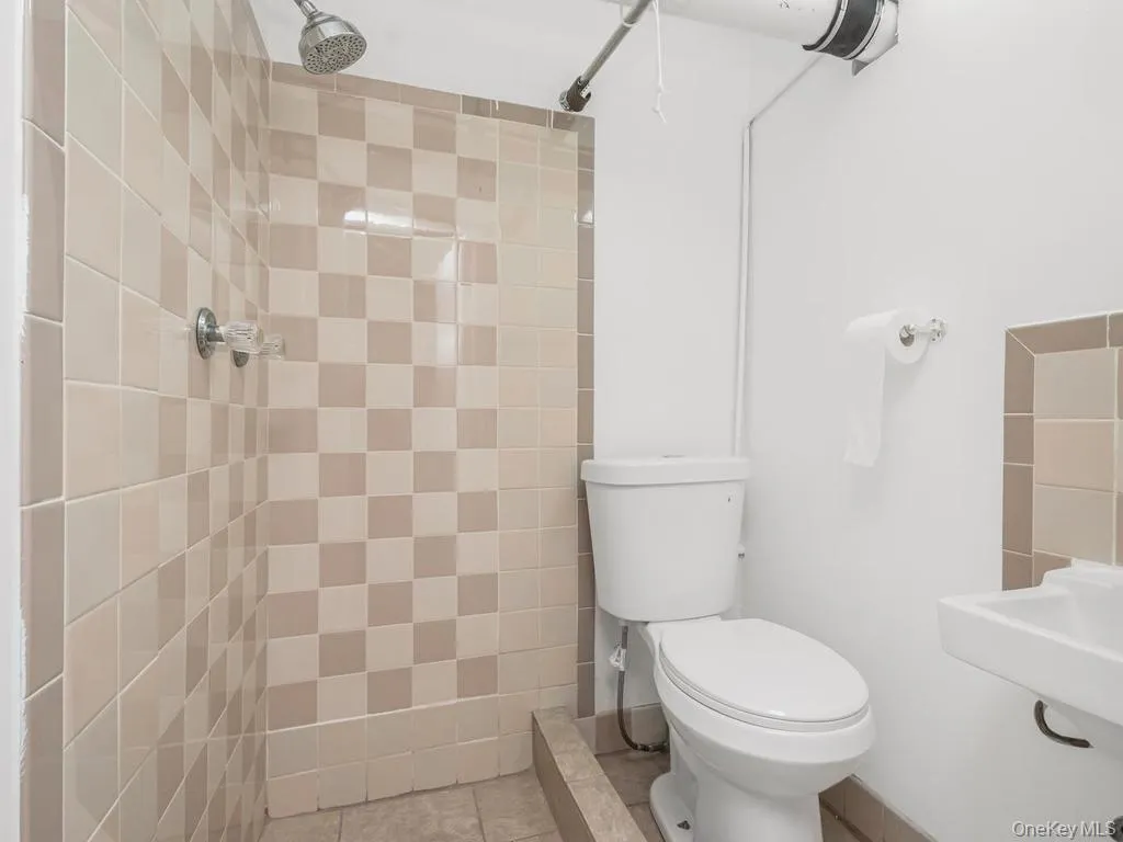 Full bathroom in the basement. Photo may be AI Edited Full bathroom in the basement. Photo may be AI Edited