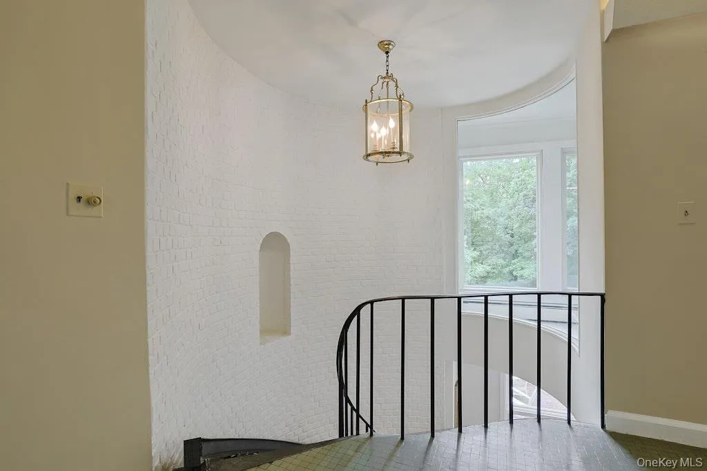 Dramatic staircase with stone steps and iron handrail Dramatic staircase with stone steps and iron handrail