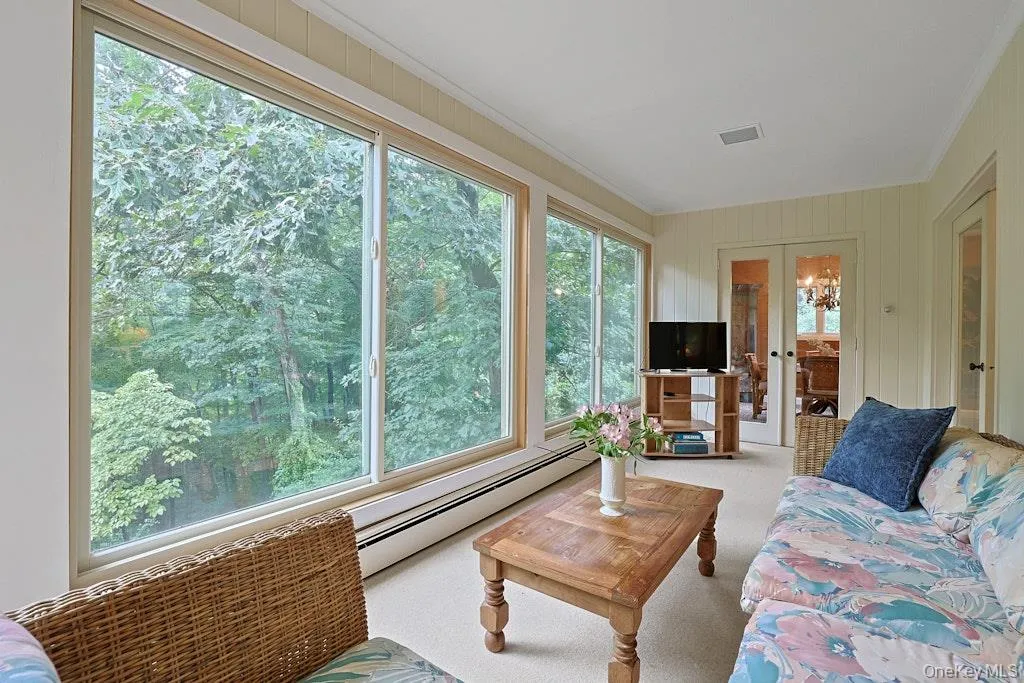 Sunroom overlooking private backyard Sunroom overlooking private backyard