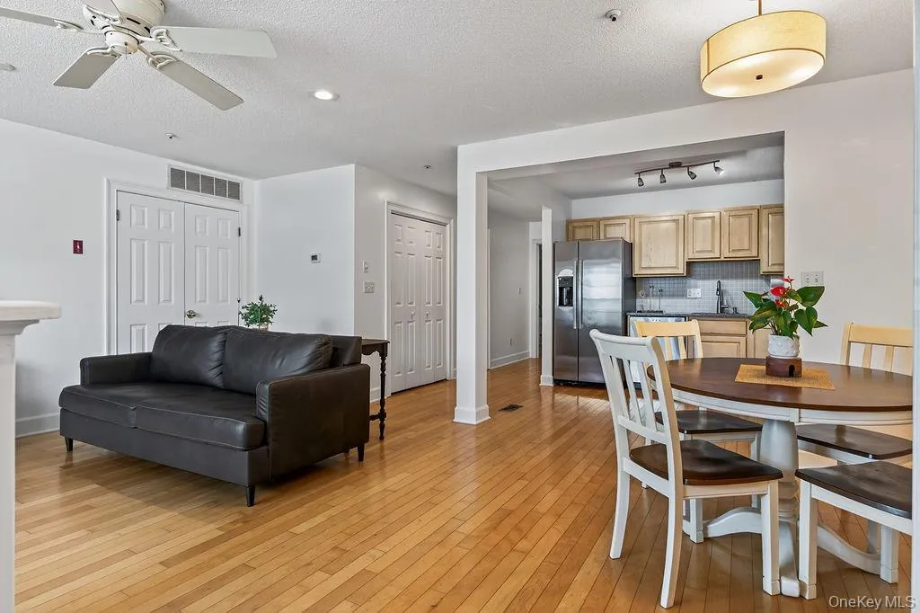 Dining area flows into the kitchen in this spacious living area with hardwood floors throughout. Dining area flows into the kitchen in this spacious living area with hardwood floors throughout.