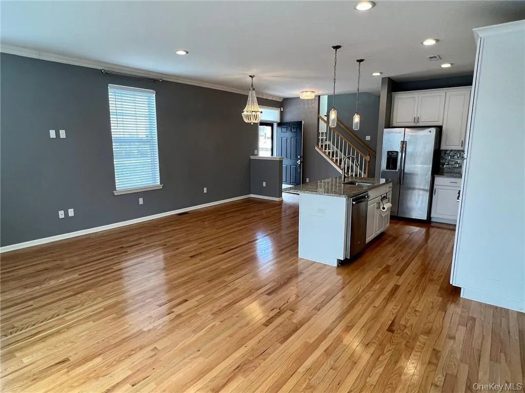 Shows kitchen, dining area and living room. Shows kitchen, dining area and living room.