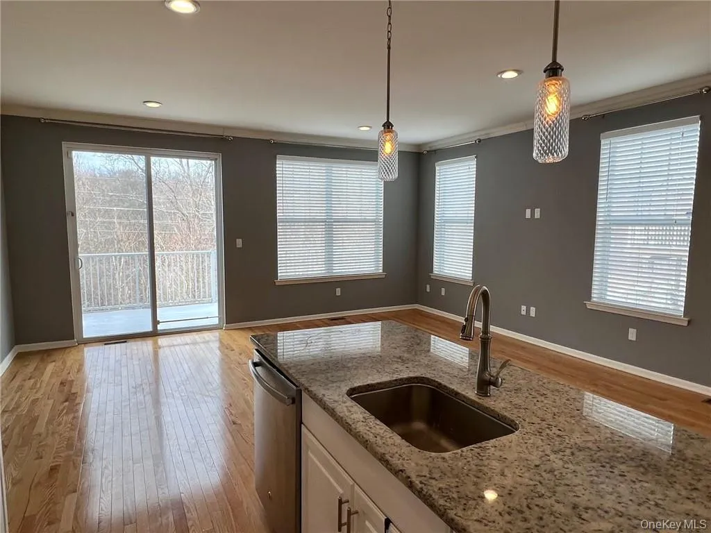 Shows kitchen, dining area and part of living room. Shows kitchen, dining area and part of living room.