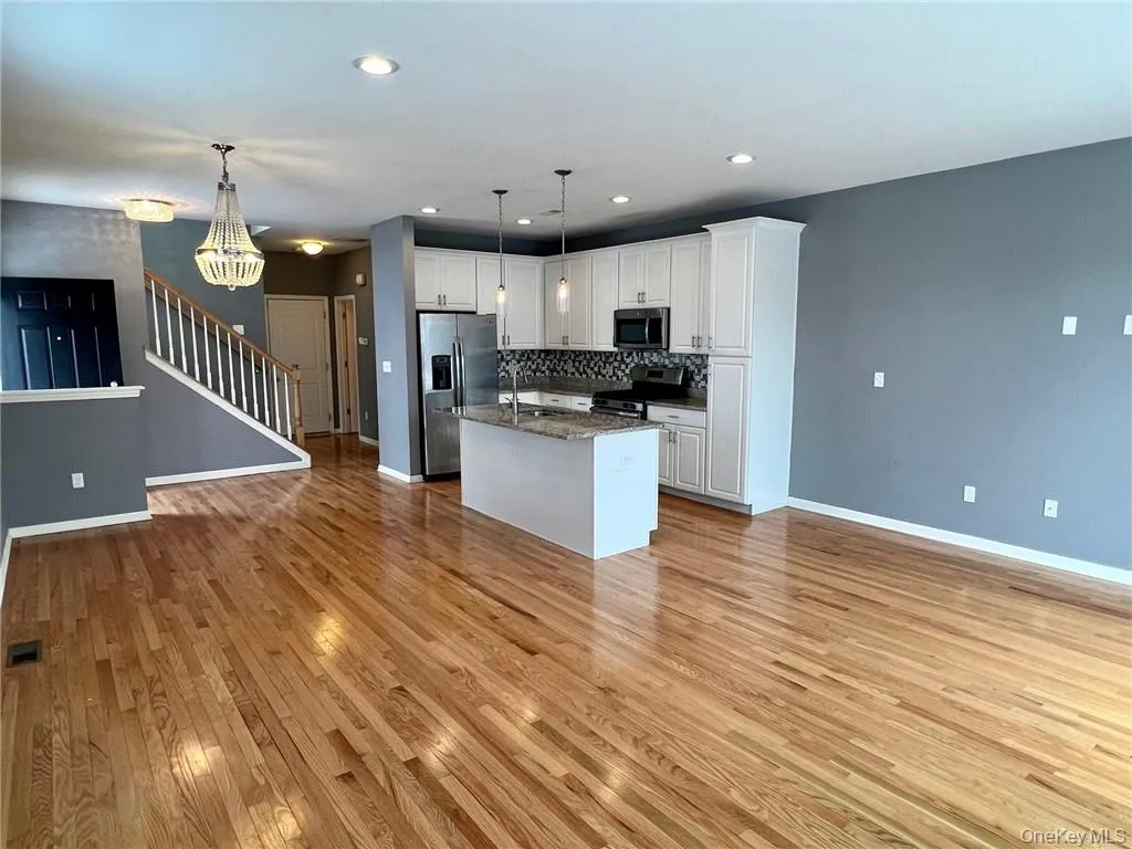 Shows kitchen, dining area and living room. Shows kitchen, dining area and living room.