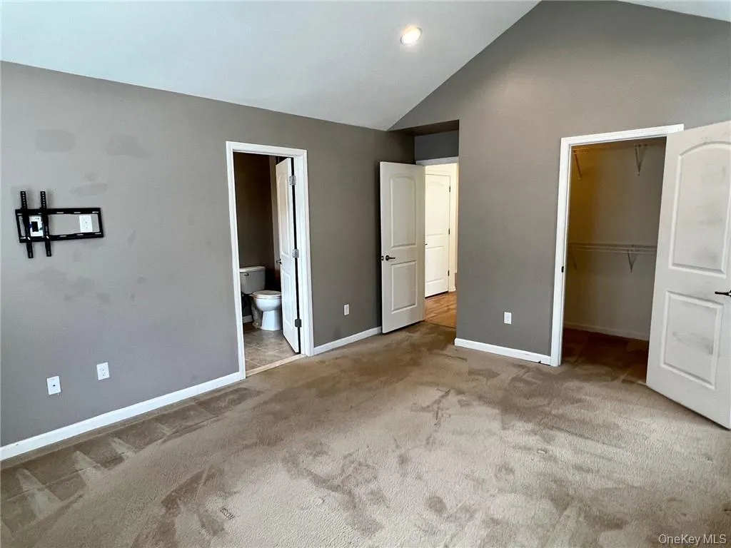 primary bedroom with walk in closet and primary bath primary bedroom with walk in closet and primary bath