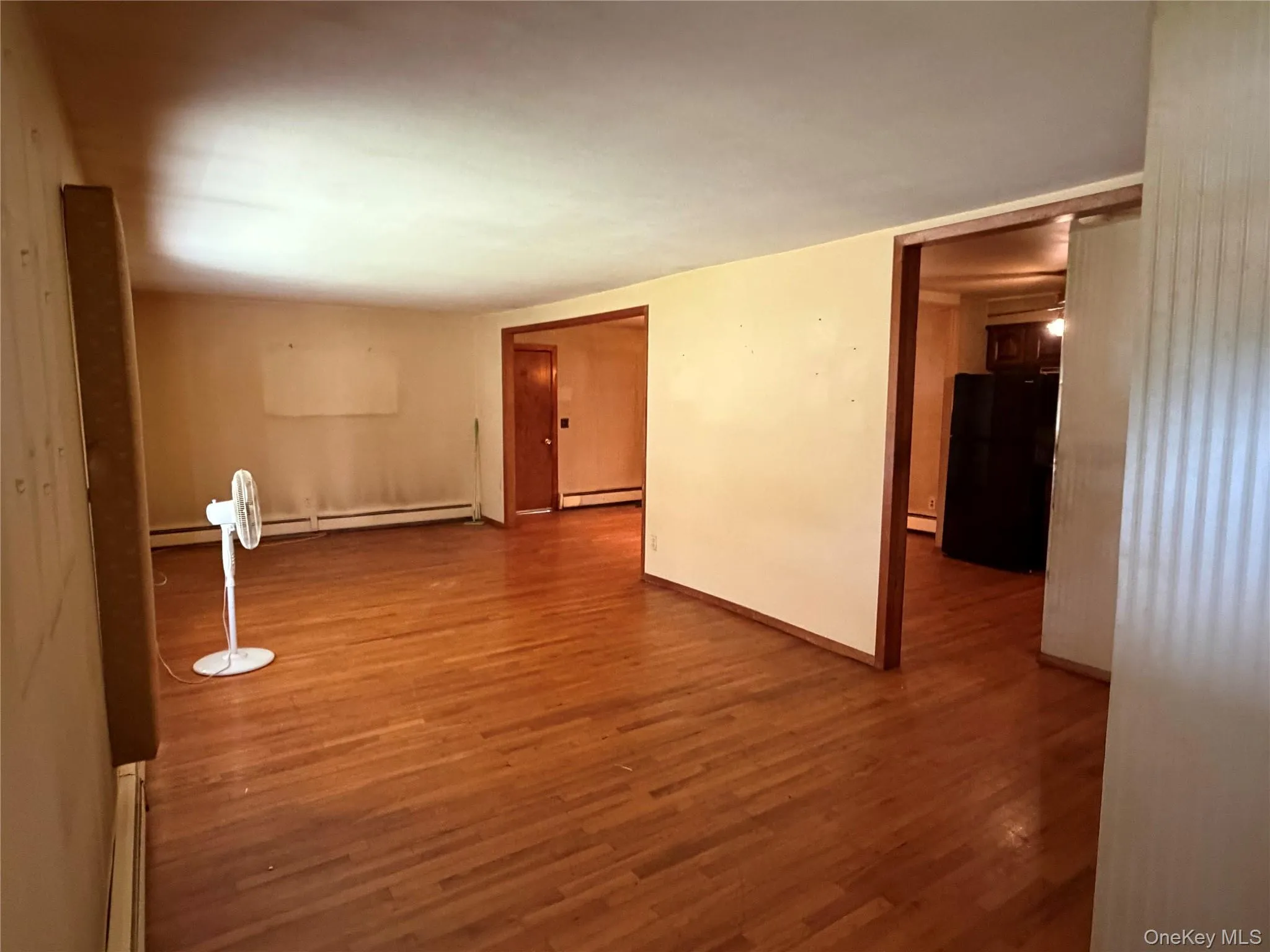 Hardwood flooring throughout featuring light-toned walls and contrasting darker trim Hardwood flooring throughout featuring light-toned walls and contrasting darker trim