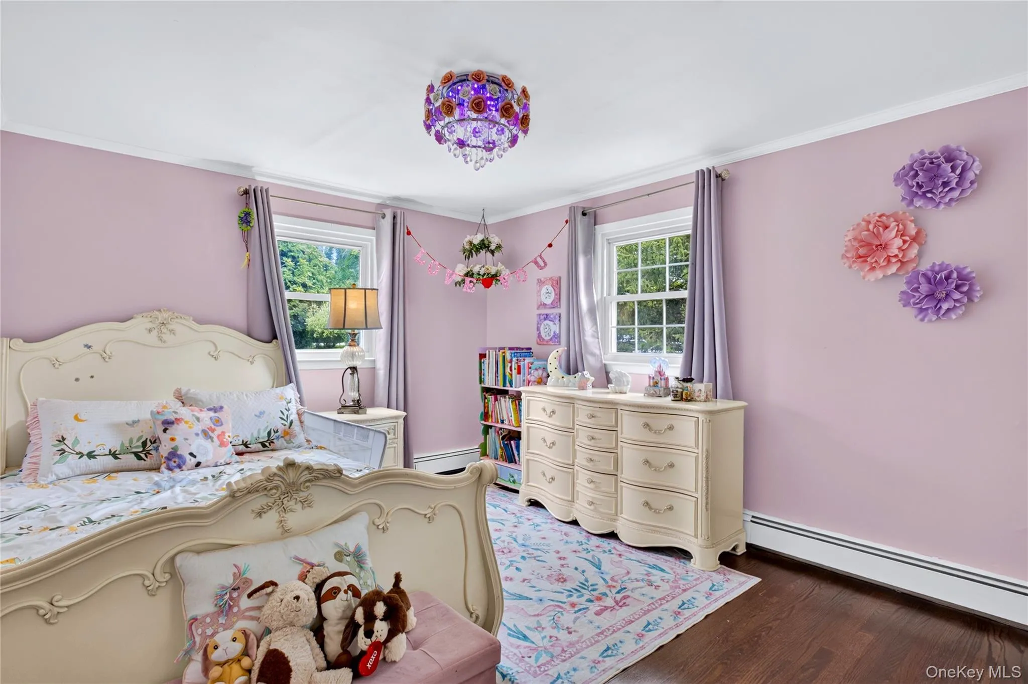 Corner bedroom with hardwood floors. Corner bedroom with hardwood floors.