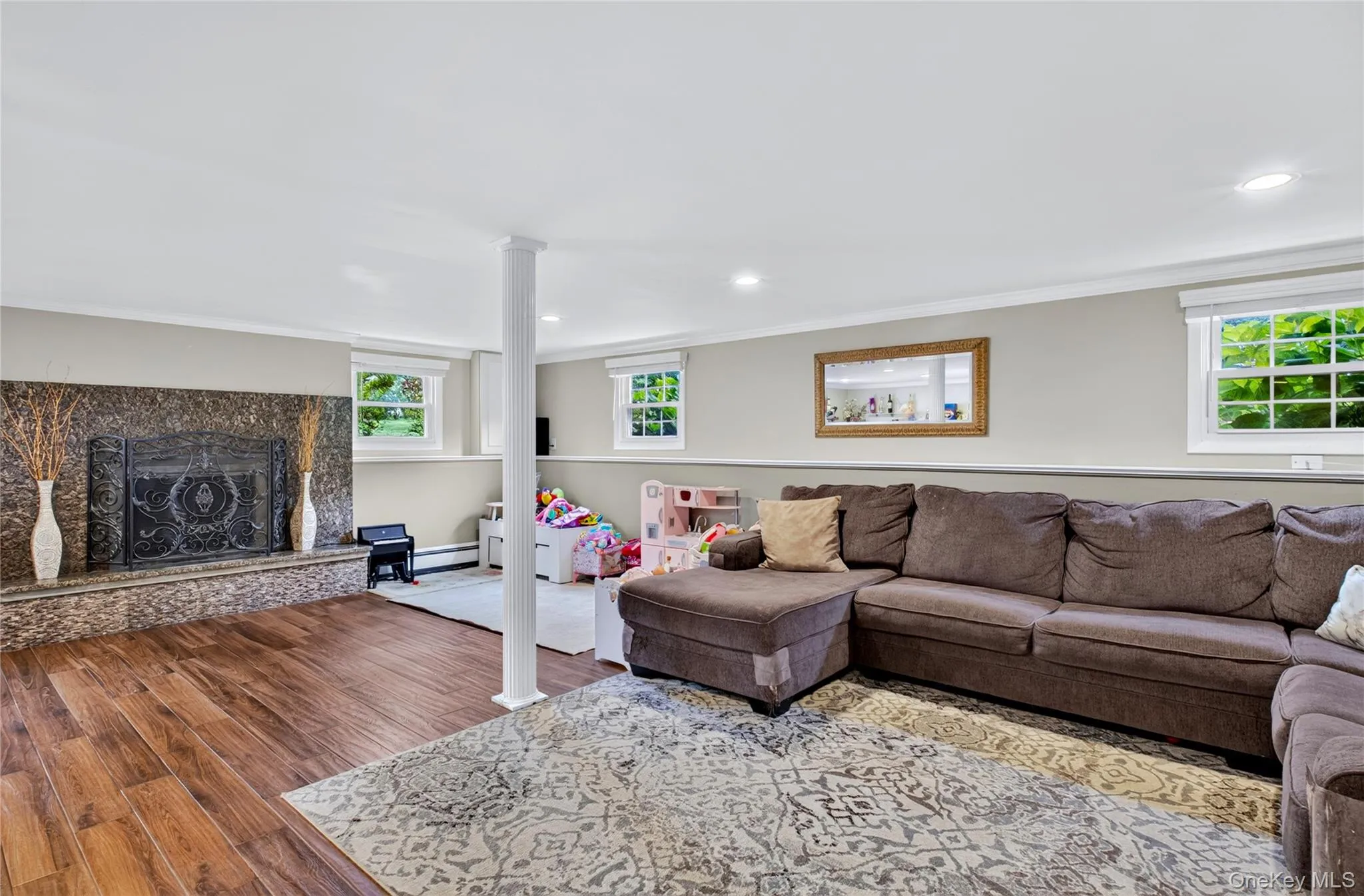 Granite adorned fireplace in Den. Tiled floor. Marble ledge around boarder. Granite adorned fireplace in Den. Tiled floor. Marble ledge around boarder.