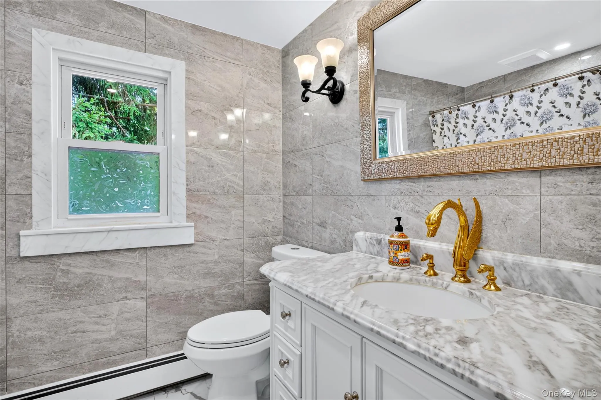Hall bath room with marble walls, counter top and floors. Hall bath room with marble walls, counter top and floors.