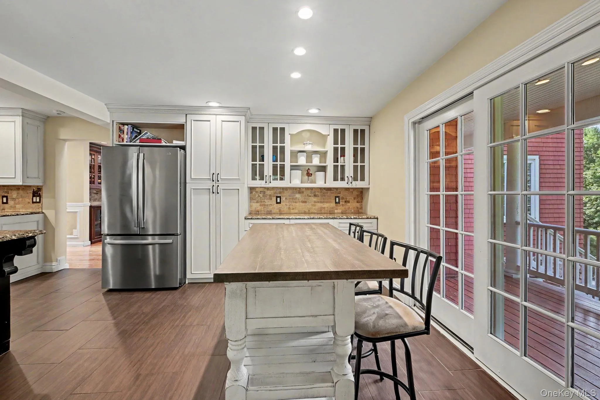 Breakfast nook with sliding glass door to covered front porch. Breakfast nook with sliding glass door to covered front porch.