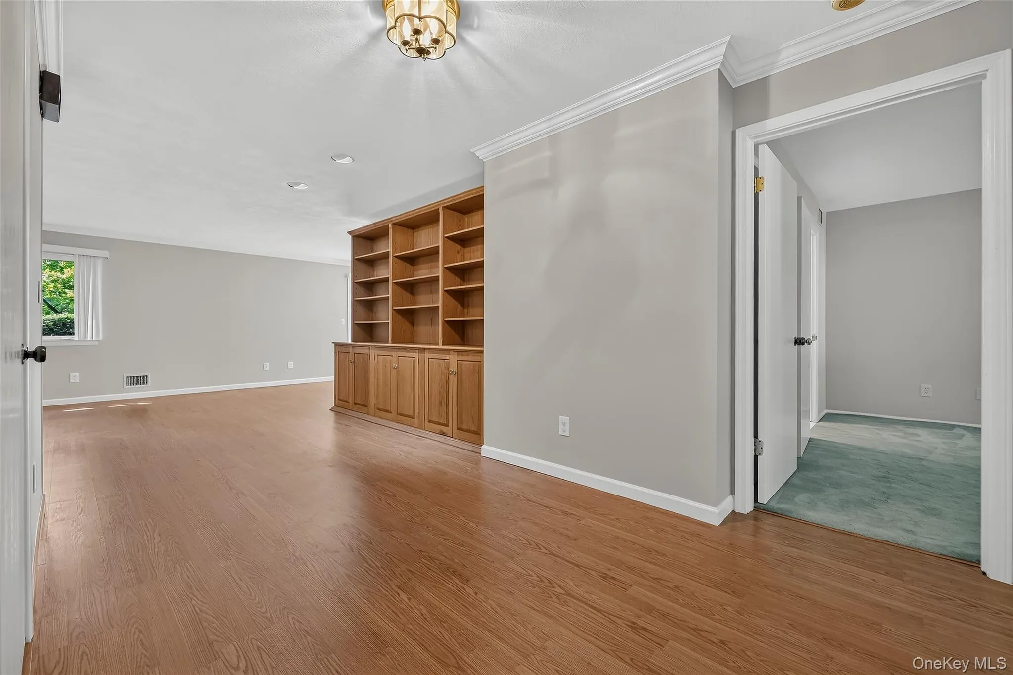 Entry to living areas with hardwood type luxury vinyl flooring Entry to living areas with hardwood type luxury vinyl flooring