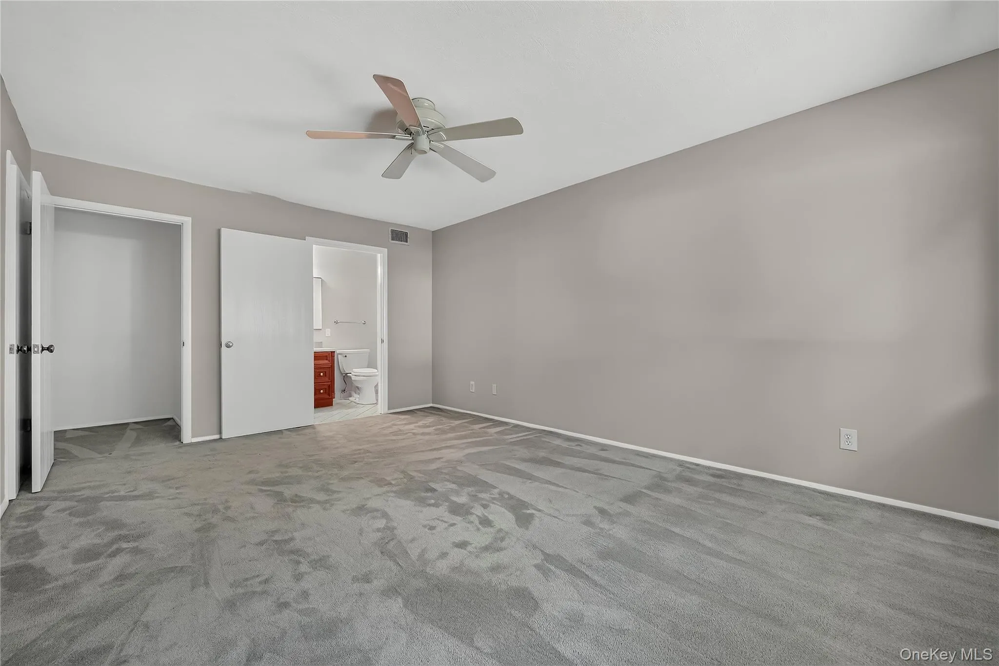 En-Suite primary bedroom with bathroom and walk in closet. En-Suite primary bedroom with bathroom and walk in closet.