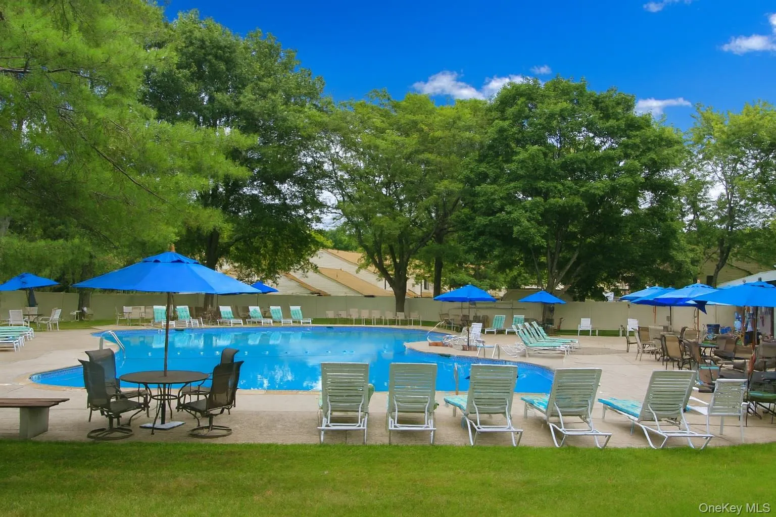 The Community Pool equipped with tables, chairs, umbrella and lounge s. The Community Pool equipped with tables, chairs, umbrella and lounge s.