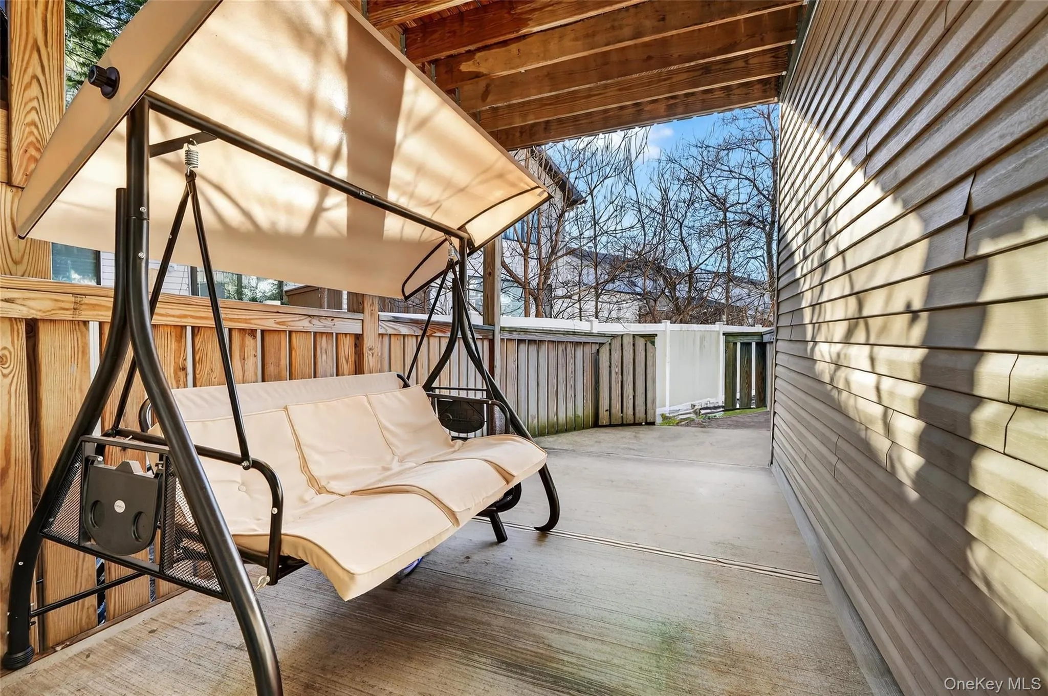 Fenced backyard featuring a patio area Fenced backyard featuring a patio area