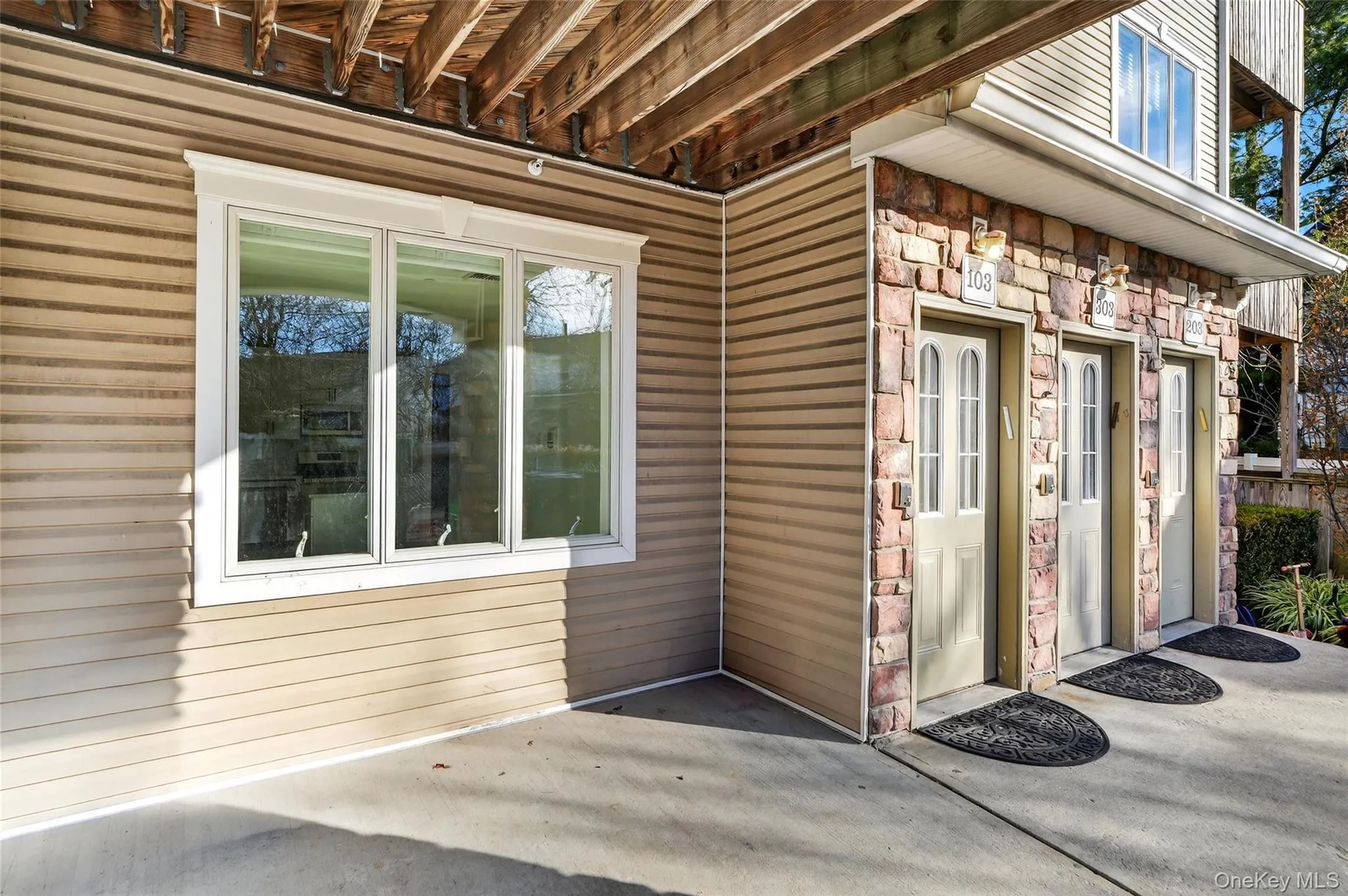 Property entrance with stone siding Property entrance with stone siding