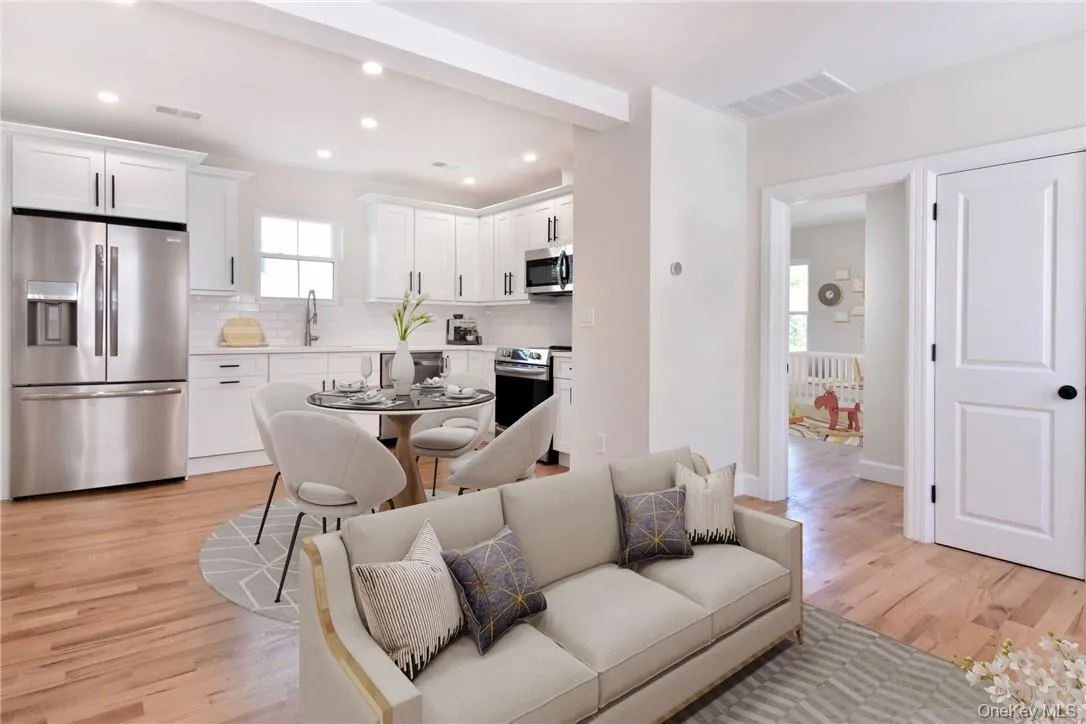 Furniture Virtually staged to show how furniture could be arranged. The kitchen and living room area are combined. Furniture Virtually staged to show how furniture could be arranged. The kitchen and living room area are combined.