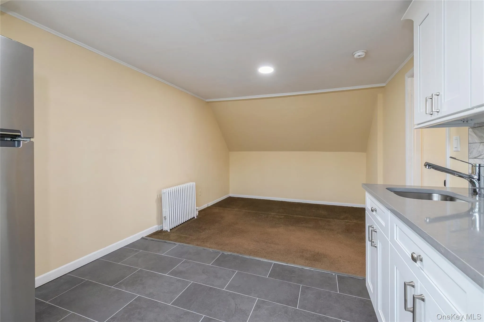 Spacious living room adjacent to the kitchen, creating a comfortable and functional open-concept living space. Spacious living room adjacent to the kitchen, creating a comfortable and functional open-concept living space.