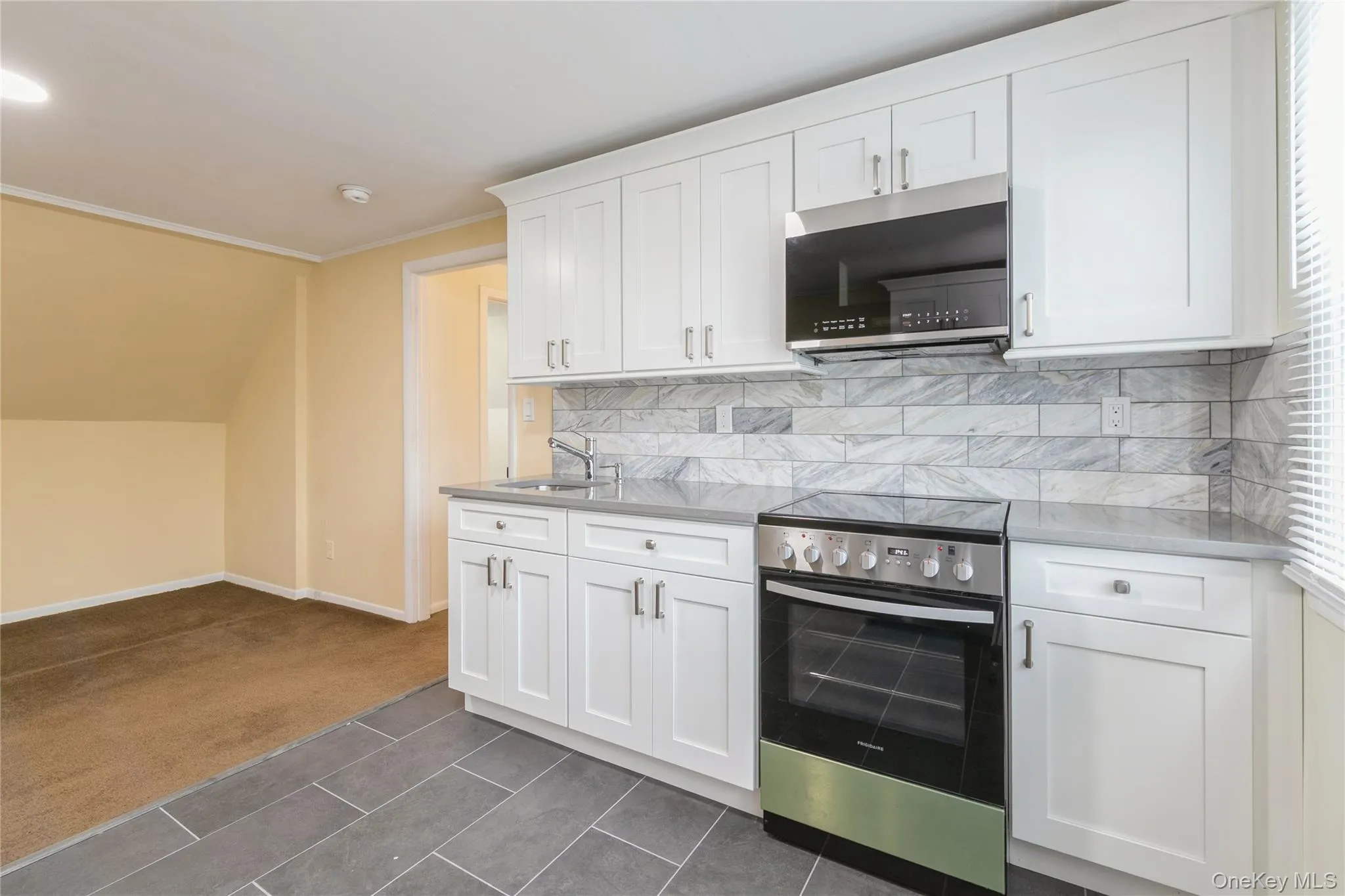 Updated kitchen with modern cabinetry, sleek finishes, and an open layout that flows seamlessly into the living area. Updated kitchen with modern cabinetry, sleek finishes, and an open layout that flows seamlessly into the living area.