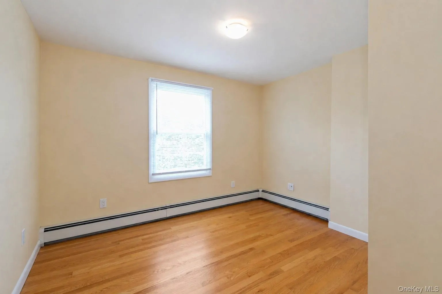 Comfortable primary bedroom with soft carpeting, natural light, and charming architectural details that create a warm and inviting retreat. Comfortable primary bedroom with soft carpeting, natural light, and charming architectural details that create a warm and inviting retreat.
